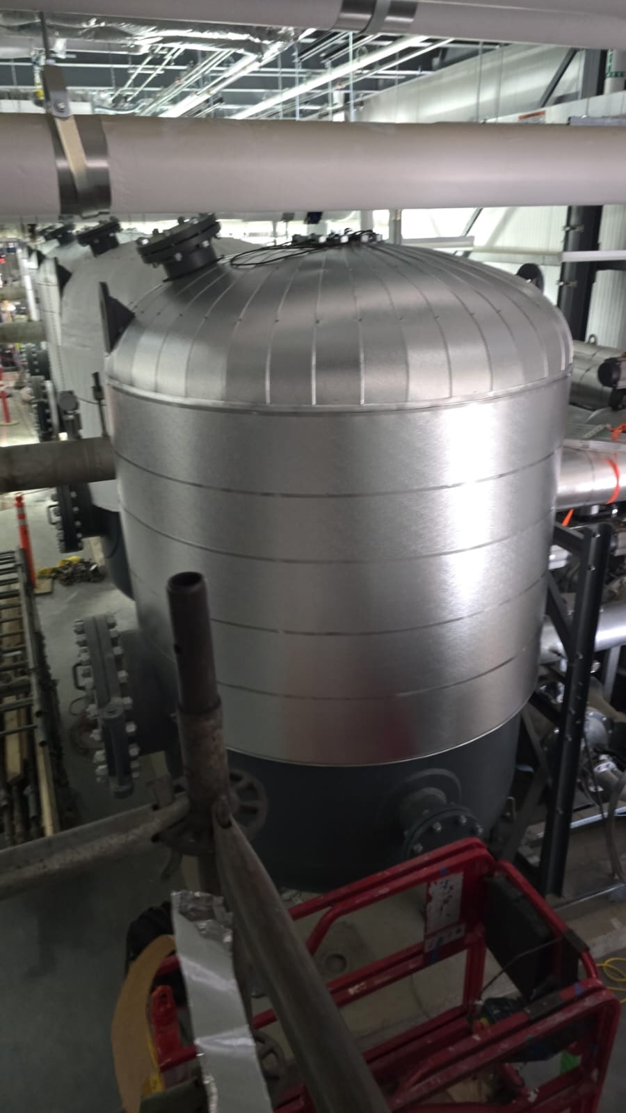 Insulated tank with metal jacketing